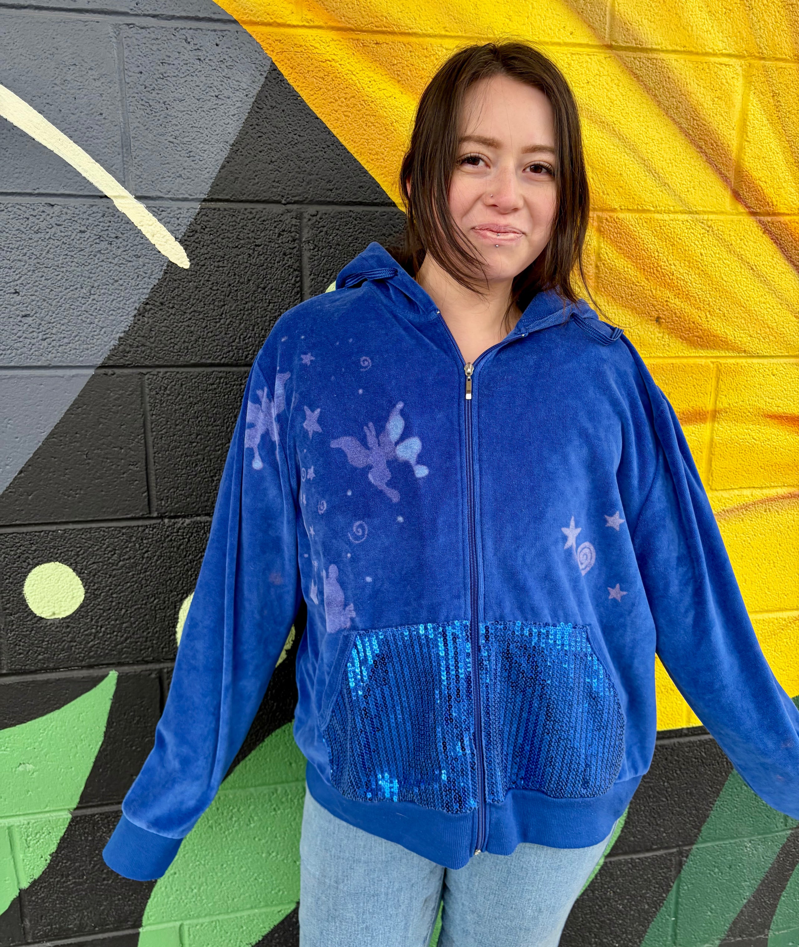 blue velvet hand-painted bleach art with sparkly pockets has butterflies flying up side of arm 