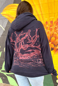 a zip up of a hand-painted lowrider under the stars and an oak tree