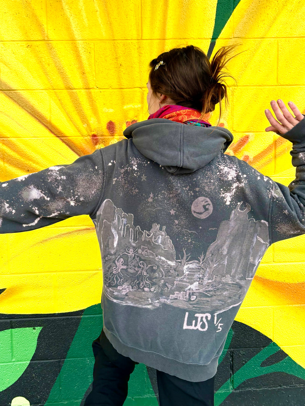 Grey zip up hand-painted bleach art  the based off of the garden of the gods the back has 3 people doing a ritual under the stars and moonlight there's mountains surrounding them 