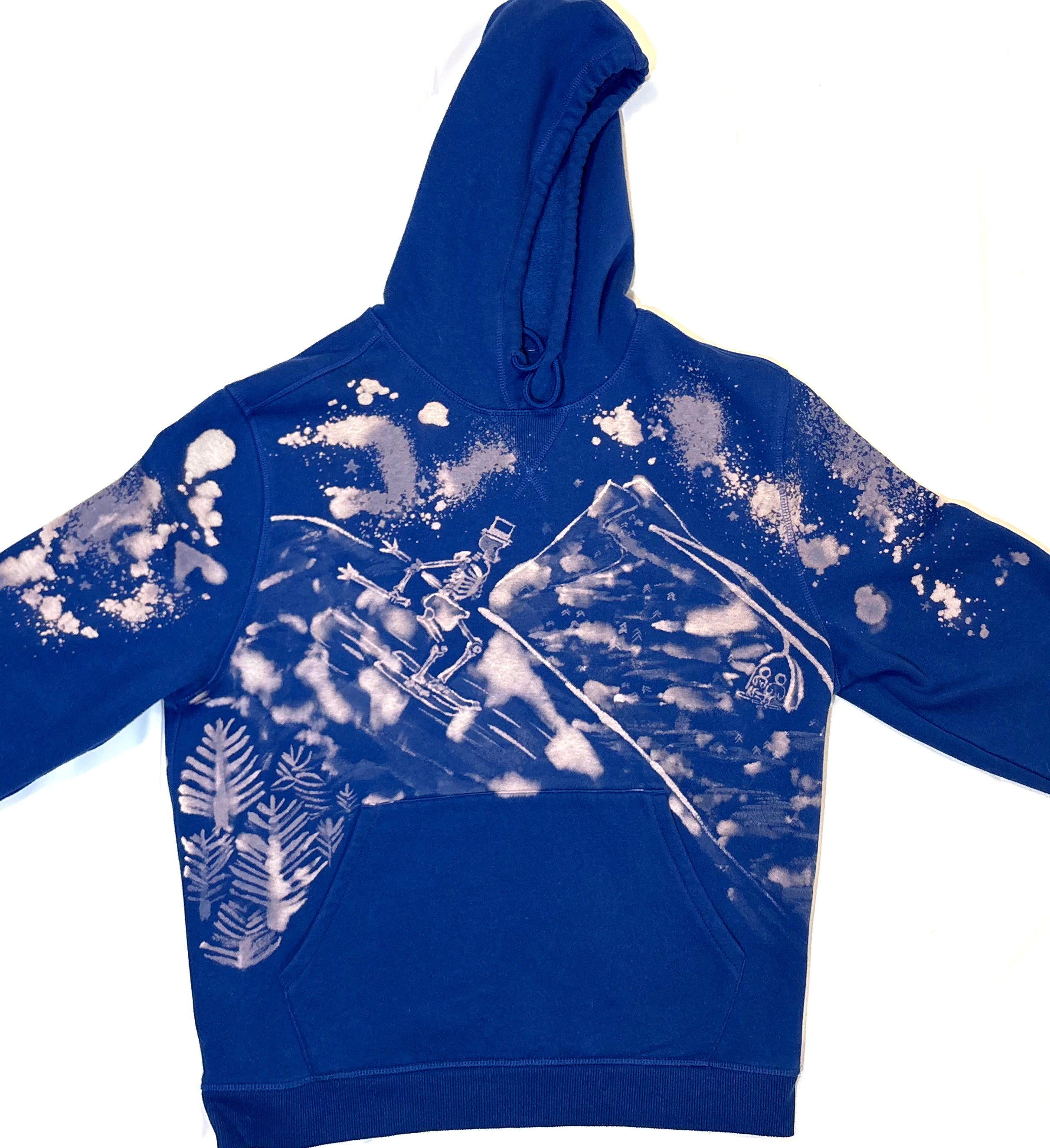 hand painted bleach art skeleton skier going down the slope with skiers going up ski lift 