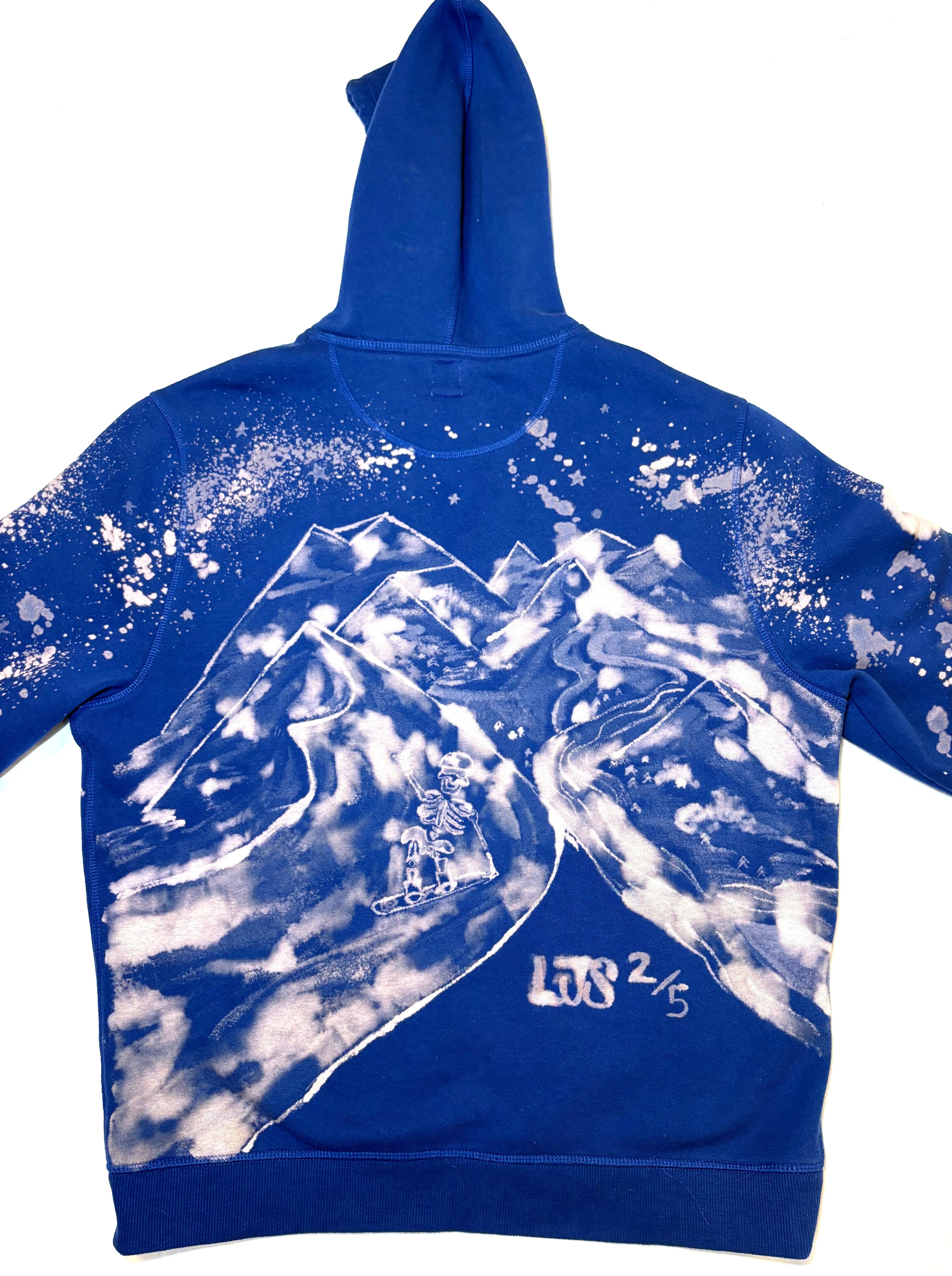 blue hand painted bleach art skeleton snowboard hitting a big jump 