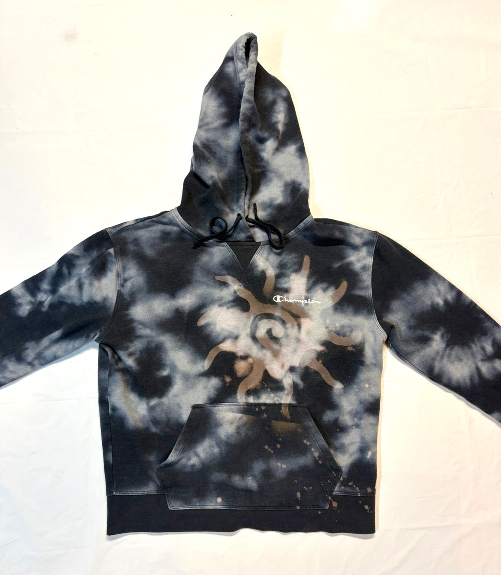 Tie-dye hoodie with a sun design on a white background