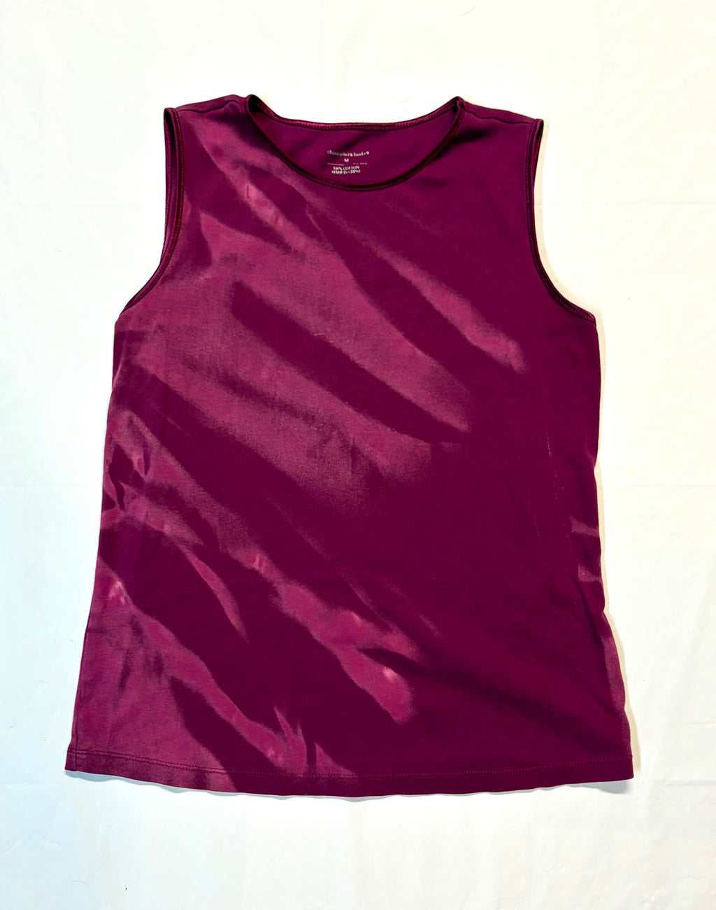 Purple tank top on a white background