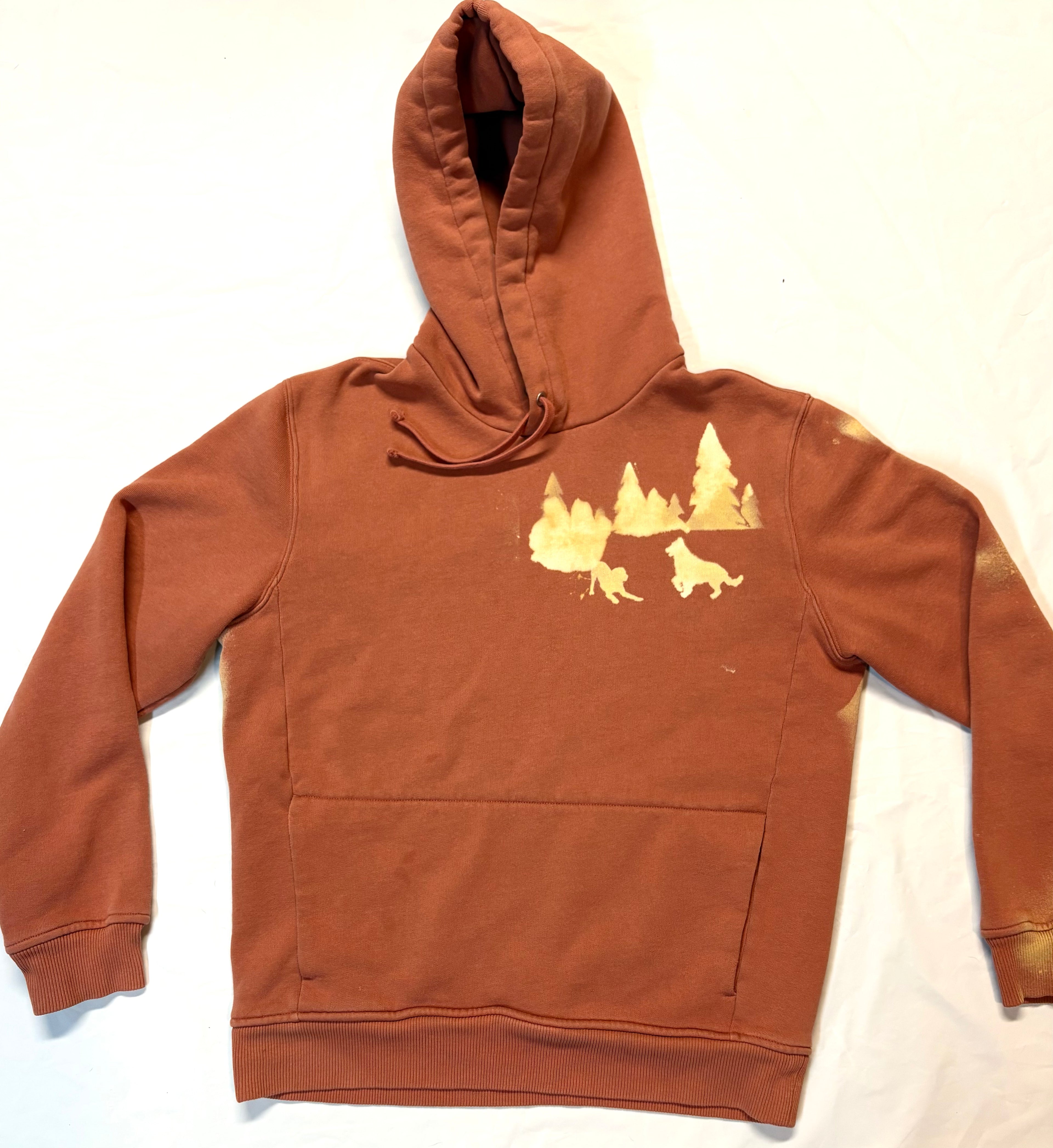 Orange hoodie with dogs and tree one the front side chest
