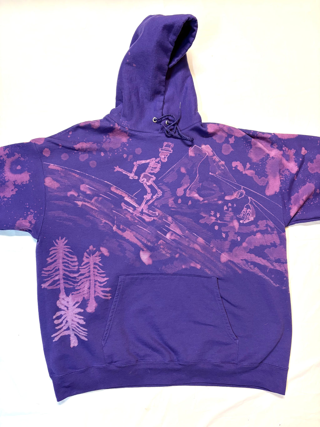 Purple bleach art hoodie of a skeleton skier going down slope