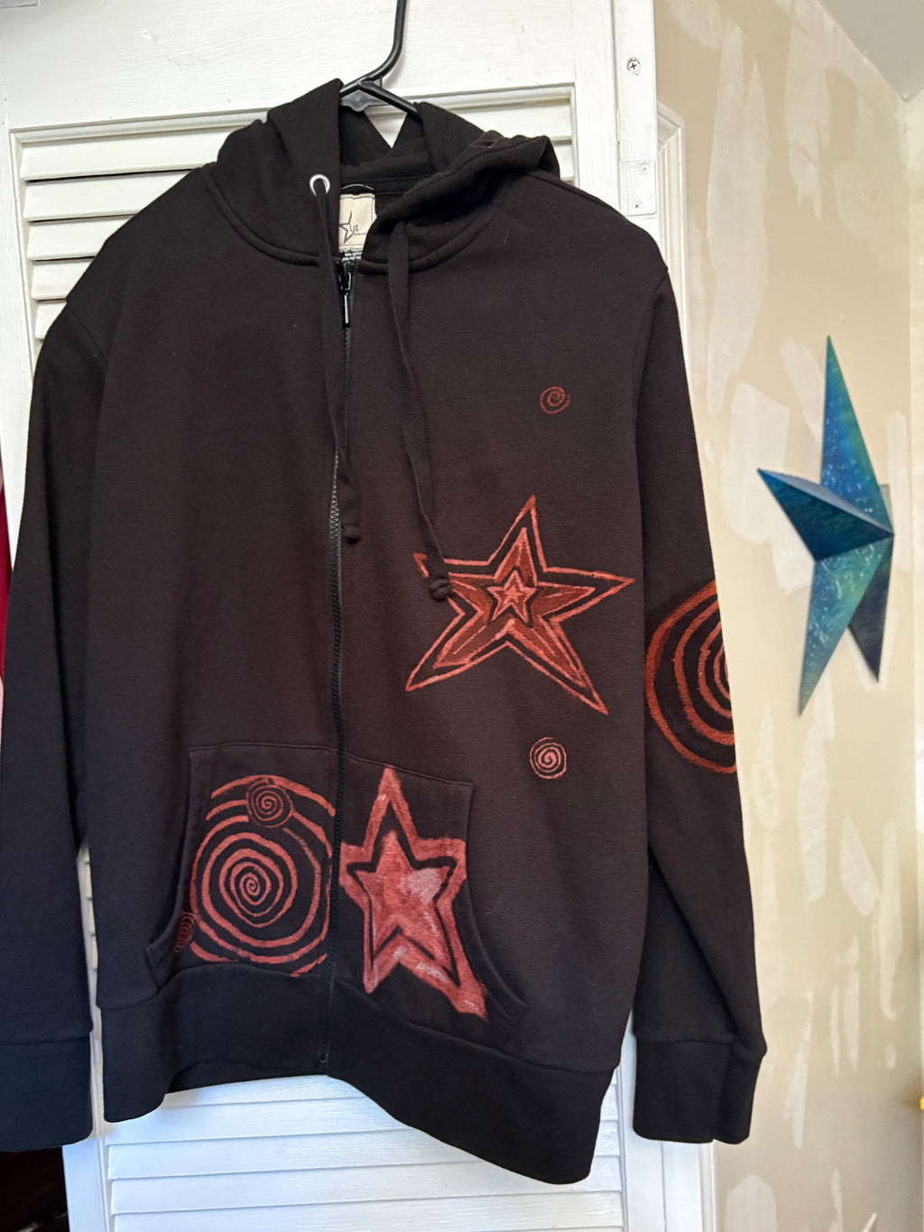 Bleach art Black hoodie with red star and spiral designs 